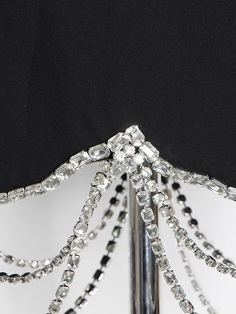 KBQ Luxury Spliced Diamonds Chain Skirt For Women High Waist Irregular Hem Mini Bodycon Skirts Female Fashion Summer Clothing