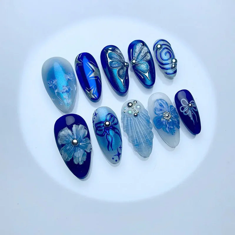 24Pcs Mid-length Blue Almond False Nails with 3D Shell Design Press on Nails Tips Butterfly Flower Pattern Datachable Fake Nail