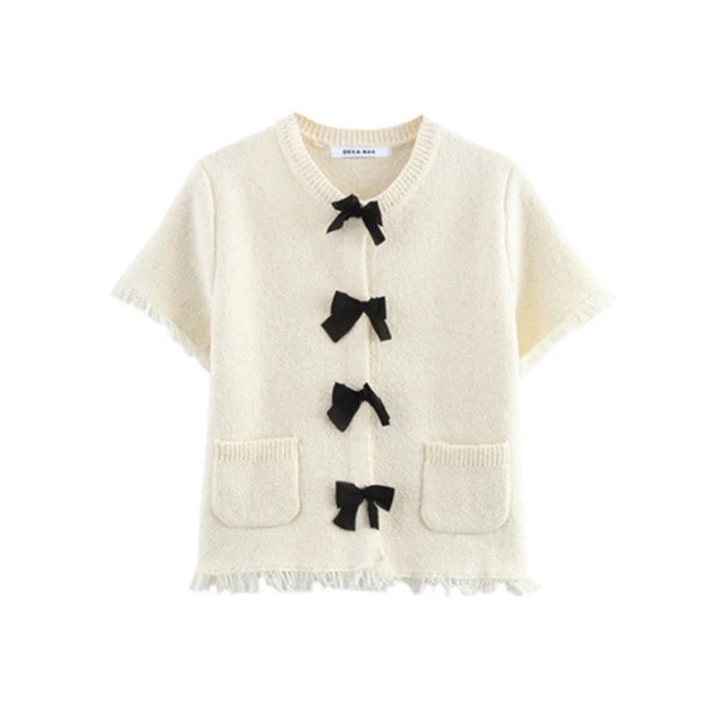 Women's suit Spring 2025 Black bow trim White knitted long-sleeved jacket Mini skirt Celebrity style Elegant